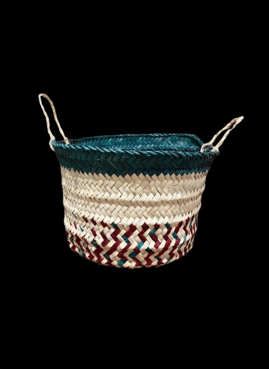 Small palm-leaf basket with a green rim and maroon base