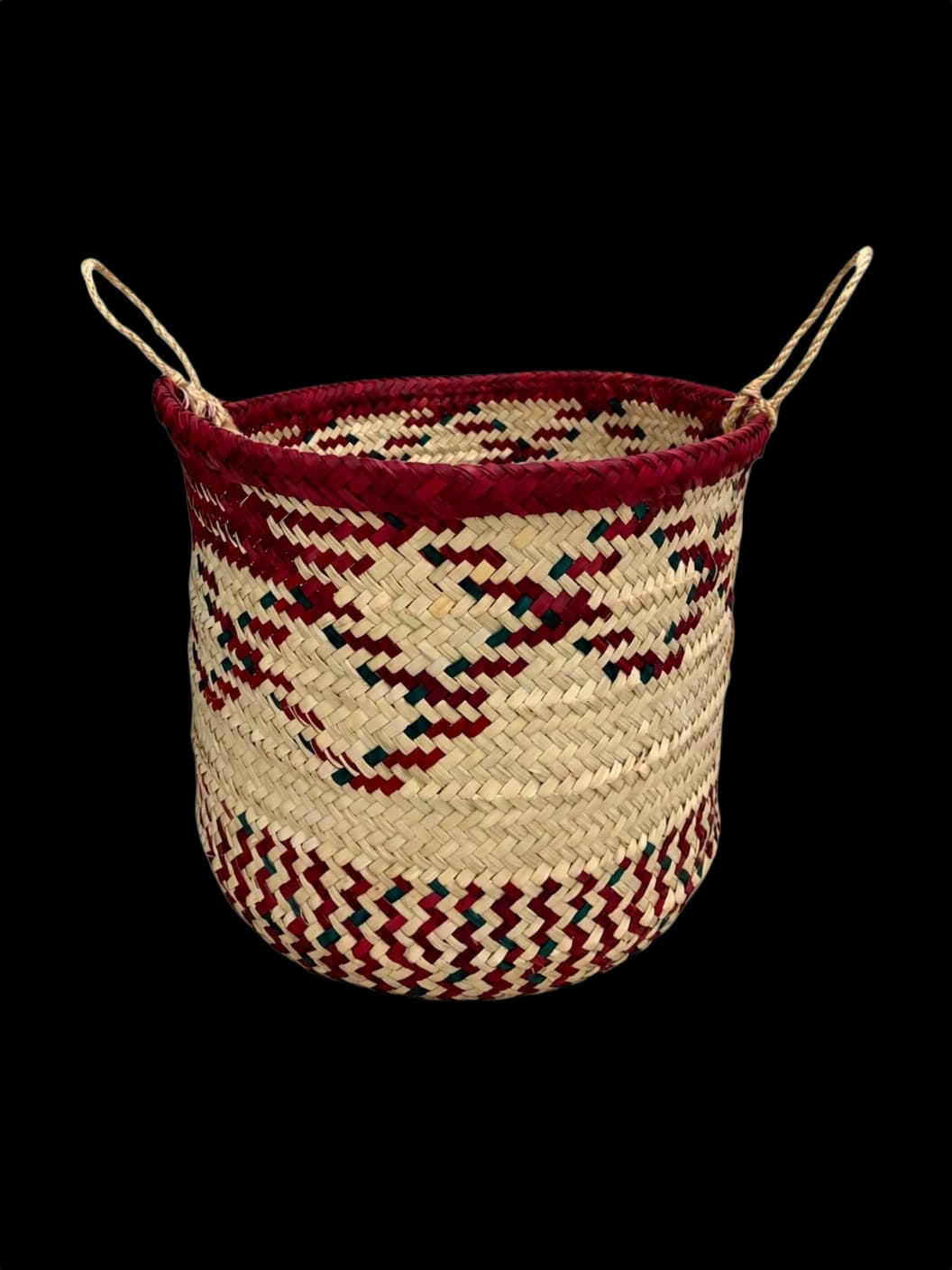Palm-leaf basket with a maroon rim and zigzag pattern