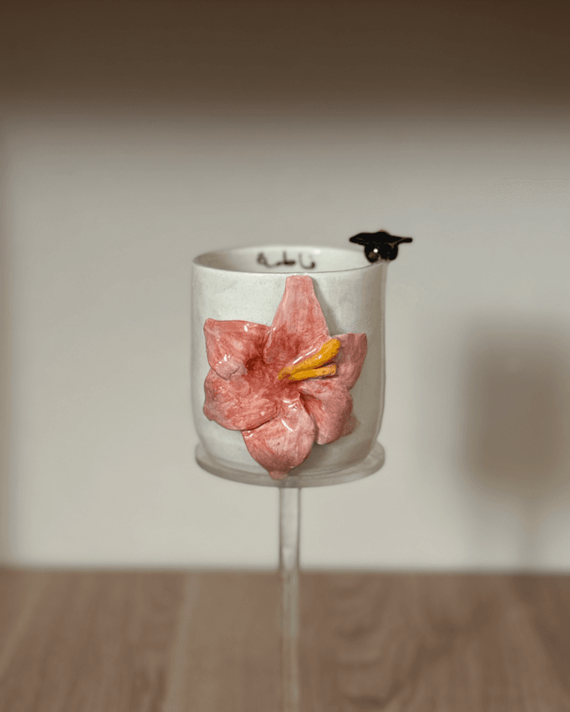 كوب تخرج بتصميم وردة من متجر متجر مونـ